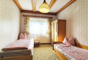 a room with two beds and a window at Almliesl KRIS-750 in Krispl