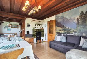 a living room with a couch and a fireplace at Almliesl KRIS-750 in Krispl