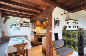 a kitchen with a table and a dining room at Almliesl KRIS-750 in Krispl +6 photos