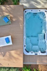 an overhead view of a hot tub on a wooden deck at Jadrija Luxury Vacations Apt1 in Šibenik