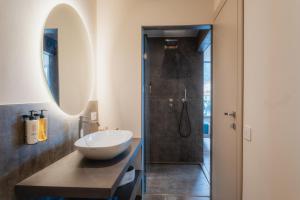 a bathroom with a sink and a shower at LKL Lakeside Lodging in Paratico +27 photos
