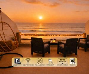 a view of the ocean with chairs and a beach at 2BR Luxury Apartment-Heart Of Taghazout, Private Beach Access, Panoramic View, Remote Work 100Mbps, Walk to Restaurants in Taghazout