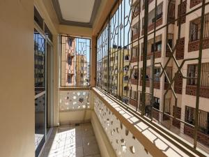 a large room with glass windows in a building at Heavenly homes apartment in Mombasa