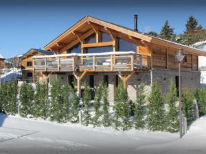 a house with a deck on the side of it at Chalet Càlid - OVO Network in Font-Romeu