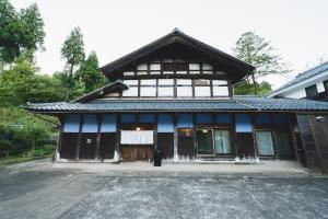 a building with a black and white building at 囲宿-Kakomiyado- in Eiheiji +45 photos