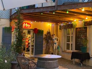 a store front with a mannequin outside of it at Le Grand Bain in Marciac