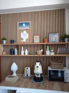 a kitchen with a counter with a toaster and a microwave at Good Morning Etna in Bronte