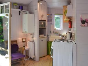 a small kitchen with a stove and a sink at Beach Retreat - Ukc2322 in St Ives