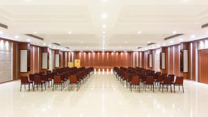 a conference room with chairs and a podium in it at Silver Oak Resort in Rājankunti