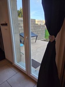 a door with a curtain in front of a window at Casa chic in Saint-Dizier