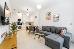 a living room with a couch and a table at He Musica in Torrevieja