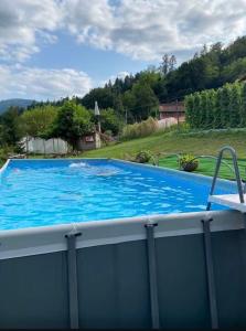 a large swimming pool with blue water at Casa Gallo Music Room in Lamon