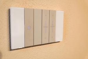 a row of white lockers on a wall at Tzia Lillina B&B in Iglesias