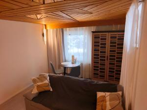 a living room with a couch and a table at Schwarzwald Apartments I in Lenzkirch