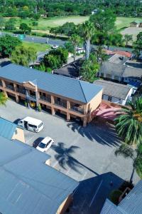 an overhead view of a building with a van in a parking lot at Masana Hotels in Polokwane