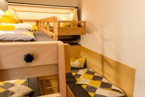 a small room with two bunk beds in it at Ferienwohnung Abraham in Nauders