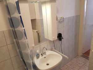 Kúpeľňa v ubytovaní Apartman Kaszás Central + 19 fotografií