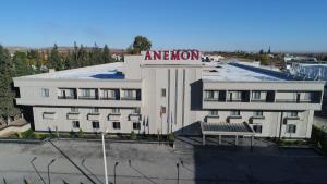 a building with a sign on top of it at Anemon Grand Şanlıurfa in Göktepe
