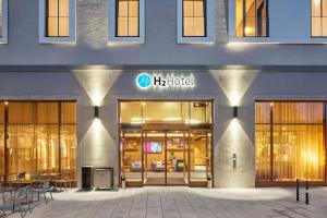a building with a h hotel sign on the front at H2 Hotel Erfurt in Erfurt +22 photos
