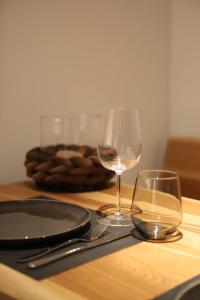 a table with two glasses of wine on a table at Gottlieber Rausch in Gottlieben