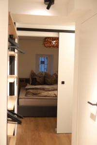 a bedroom with a bed in a room with a window at Gottlieber Rausch in Gottlieben +13 photos