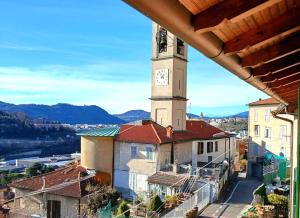 a clock tower on top of a building at Ca' del Giuli in Maslianico