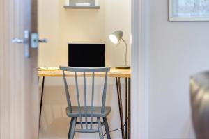 a desk with a chair and a laptop computer on it at 2 Bed in Wem oc-o30240 in Preesgreen
