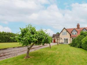 an apple tree in the yard of a house at 2 Bed in Wem oc-o30240 in Preesgreen