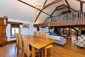 a dining room with a wooden table and chairs at Finest Retreats - Fletland Mill in Stamford