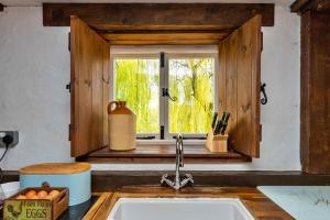a kitchen sink with a window in a kitchen at Finest Retreats - Fletland Mill in Stamford +27 photos