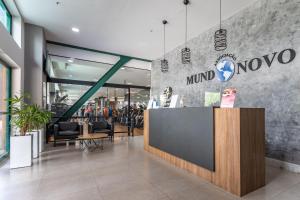a lobby of a mordo store with a counter at Pineapples BPremium - Excelentes suítes in Rio de Janeiro +83 photos