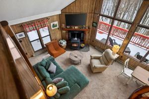 an overhead view of a living room with a couch and chairs at Pet-Friendly w Fire Pit Grill & Resort Access in Hedgesville +88 photos