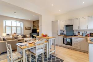 a kitchen and living room with a table and chairs at 2 Bed in Selside oc-ds1067 in Selside