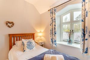 a bedroom with a bed and a window at 2 Bed in Selside oc-ds1067 in Selside