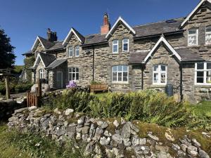 a stone house with a stone wall in front of it at 2 Bed in Selside oc-ds1067 in Selside
