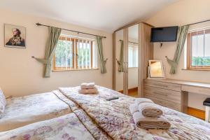 a bedroom with a bed with a teddy bear on it at 4 Bed in Wonastow oc-k29425 in Wonastow