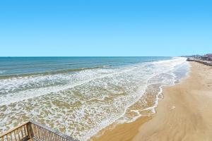 a view of a beach with the ocean at Iconic A Frame Sleep Over the Gulf in Surfside Beach