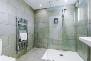 a bathroom with a shower and a sink at Slyne Lodge in Hest Bank +28 photos