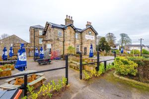 a building with blue signs in front of it at Slyne Lodge in Hest Bank
