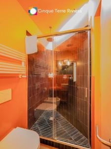 a bathroom with a shower and a toilet at Isabella Boutique Rooms in Levanto +35 photos