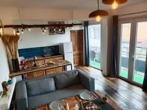 a living room with a couch and a table at La lanterne in Antananarivo