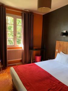 a bedroom with a large bed and a window at Paloma in Hossegor