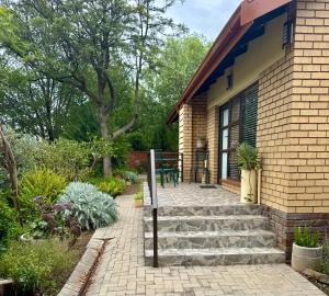 a patio with stairs leading to a house at Joba-Rus in Bloemfontein