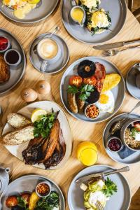 a table with plates of breakfast food on it at Bertram's in Warkworth