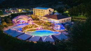 an overhead view of a pool at a resort at night at Hotel Piccolo Paradiso - Latronico "Terme" in Latronico