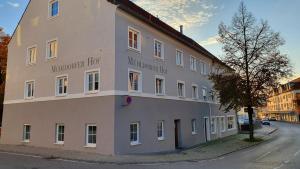 a large building on the side of a street at Mühldorfer Hof in Altötting