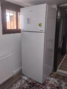 a white refrigerator in a room with a window at Minihome Konak in Safranbolu