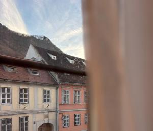 a view from a window of a building at Kromatic 5 Boutique Studios - Old town Center in Braşov