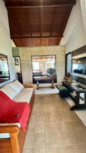 a bedroom with a bed and a desk in a room at Residencial Zirke in Florianópolis