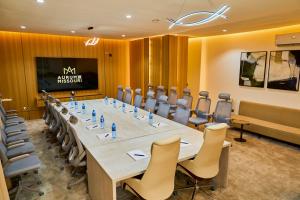 a large conference room with a long table and chairs at Aurum on Missouri in Abuja +99 photos